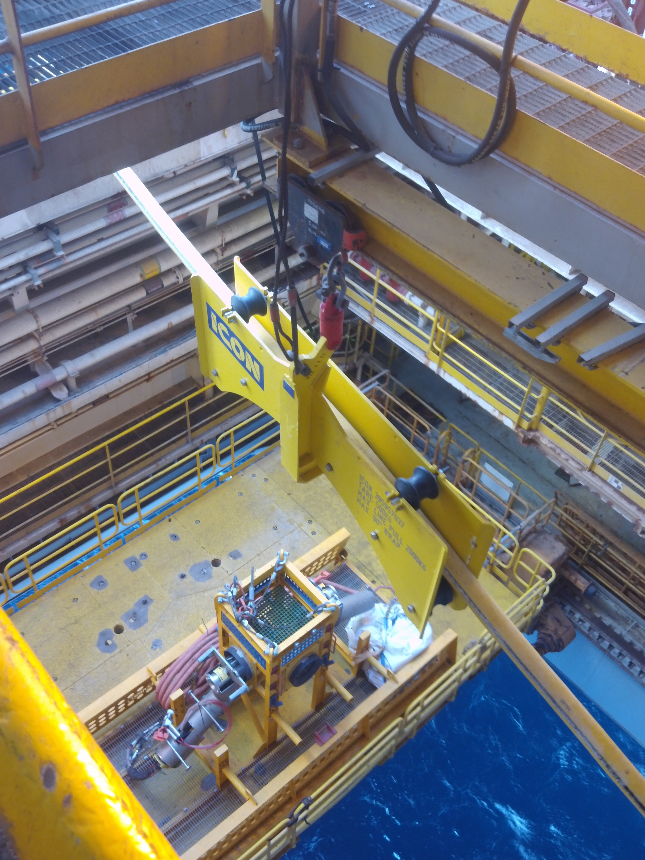 An ICON-built Intermediate Umbilical Sheave in the moonpool of the DPS1 drilling rig for a Subsea Jumper Deployment Frame deployment in the Carnarvon Basin, Western Australia